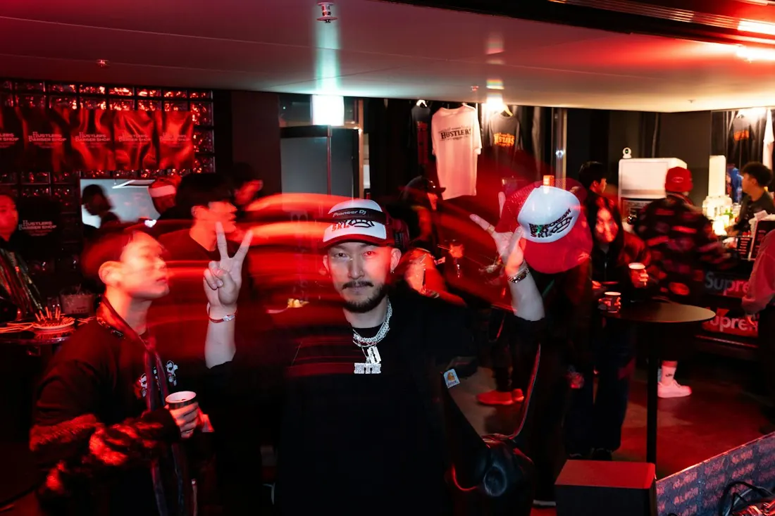 Guests posing with microphones at a night event