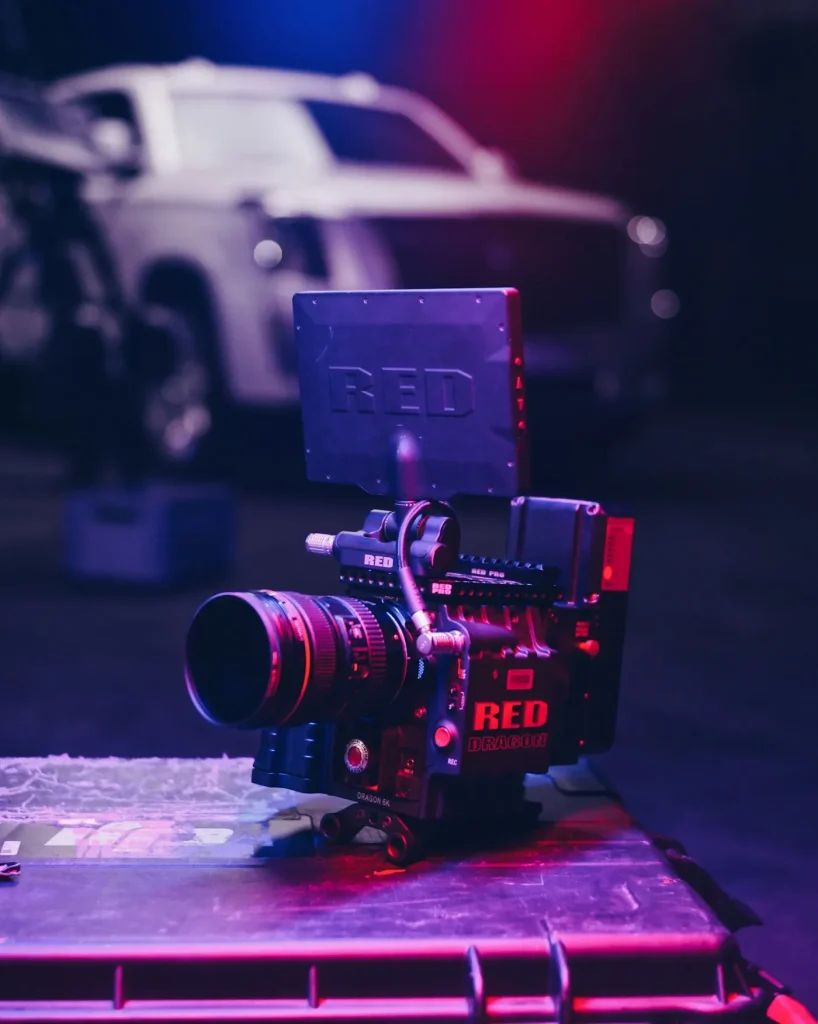 Cinema camera lit in red on a production set