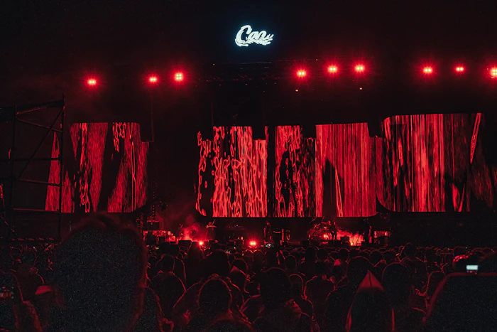 Crowd in front of a red LED stage