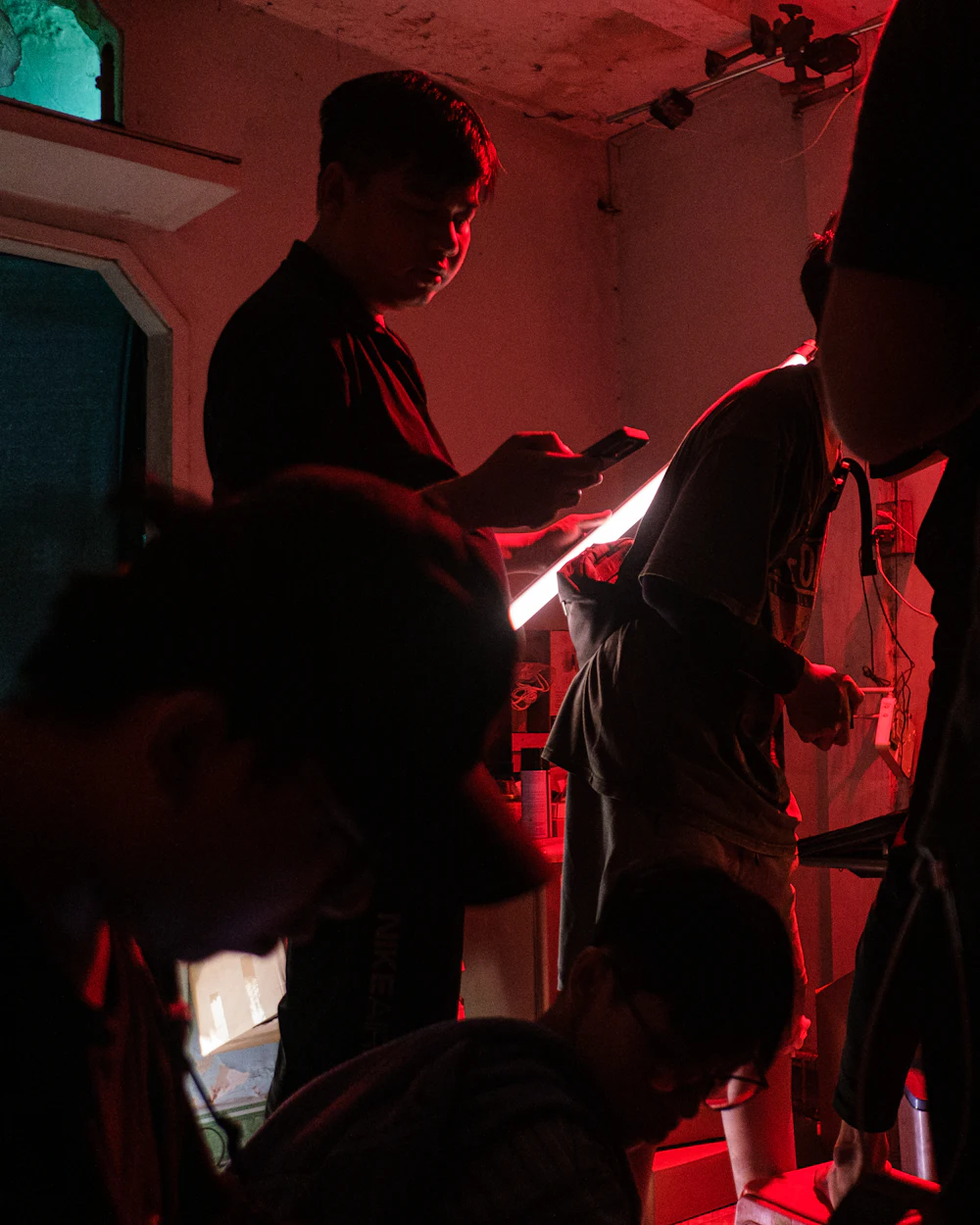 Crew filming under red light