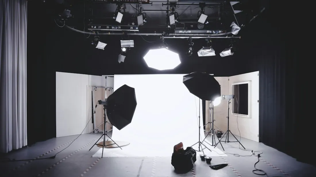 Photo studio with softboxes and a white backdrop